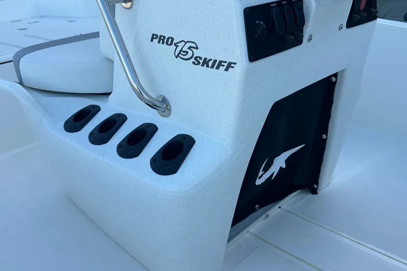Slide: The Image of 2026 Mako Pro Skiff 15 CC boat console with rod holders and control panel. - 17