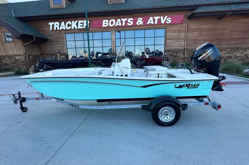 Slide: The Image of 2026 Mako Pro Skiff 15 CC boat on trailer outside Tracker Boats & ATVs store. - 7