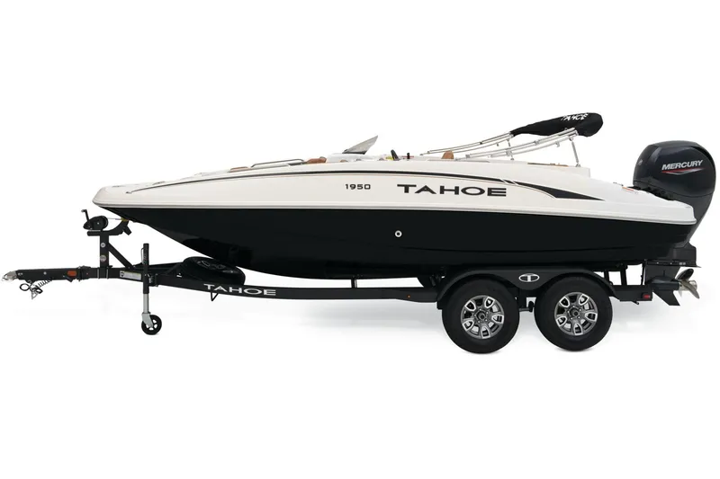 Slide: The Image of 2026 Tahoe 1950 boat interior with brown and black seating, steering console, and cup holders. - 4