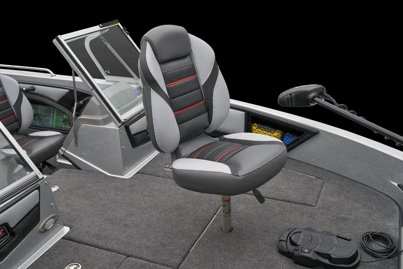 Slide: The Image of 2026 Ranger 1880MS boat interior with green seats, steering wheel, and dashboard controls. - 16