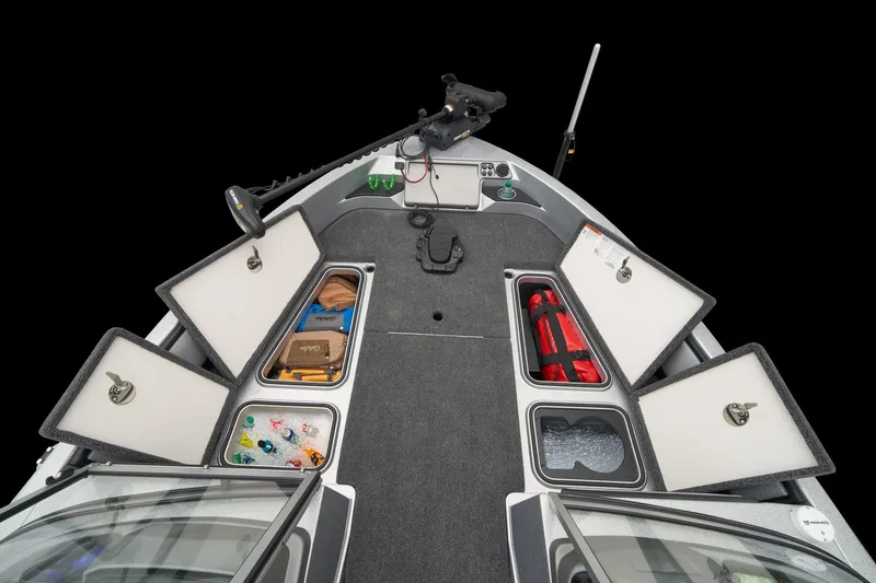 Slide: The Image of 2026 Ranger 1880MS boat storage compartments with open lids and secure locks. - 22