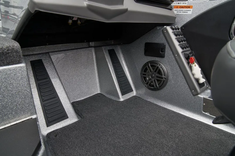 Slide: The Image of 2026 Ranger 1880MS boat interior with open storage compartment and green seats. - 40