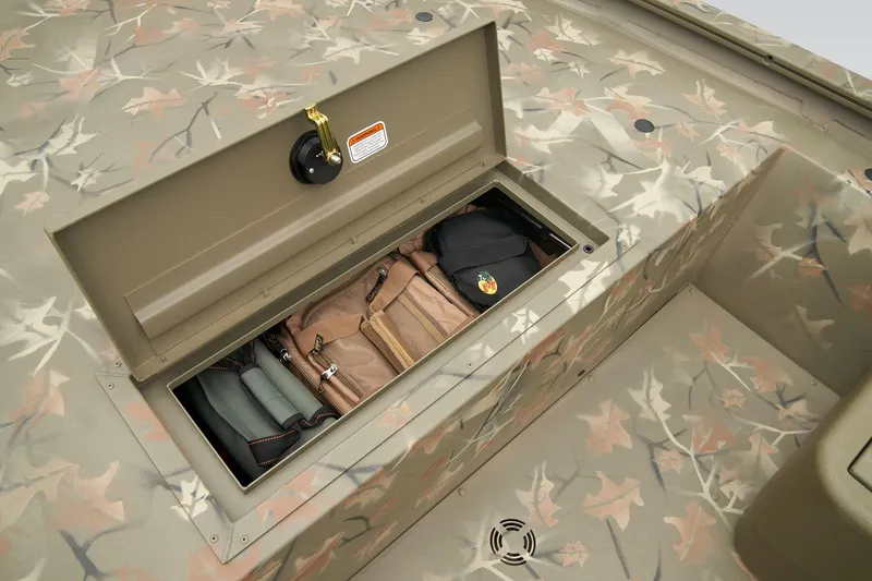 Slide: The Image of 2026 Tracker Grizzly 1754 SC boat with camo seat on deck. - 10