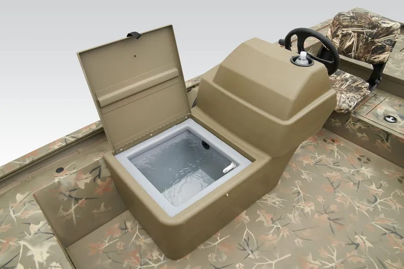 Slide: The Image of 2026 Tracker Grizzly 1754 SC boat interior with steering wheel and camo seats. - 14