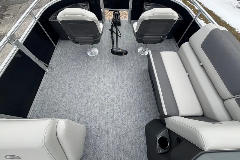 Slide: The Image of 2026 Sun Tracker Fishin' Barge 20 DLX interior with seating and fishing setup. - 98