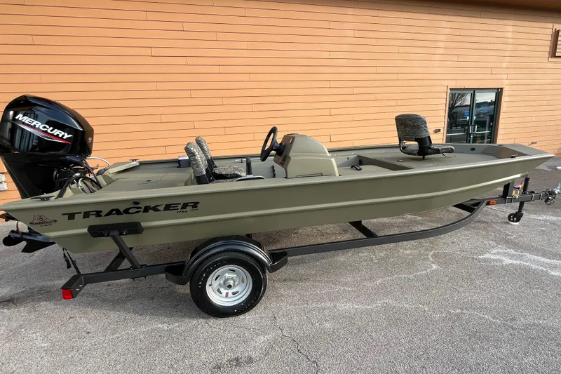 The Image of 2026 Tracker Grizzly 1754 SC boat on trailer with Mercury outboard motor. - 0