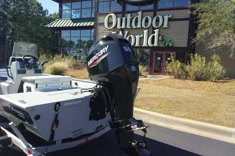 Slide: The Image of 2026 Tracker Bass Tracker Classic CC boat outside Outdoor World store. - 6