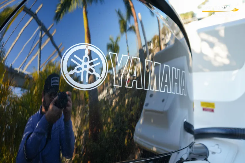 Slide: The Image of Reflection on Yamaha engine of 2023 Key West 219 FS boat. - 13