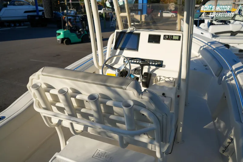 Slide: The Image of 2023 Key West 219 FS boat interior with helm, rod holders, and navigation equipment. - 18