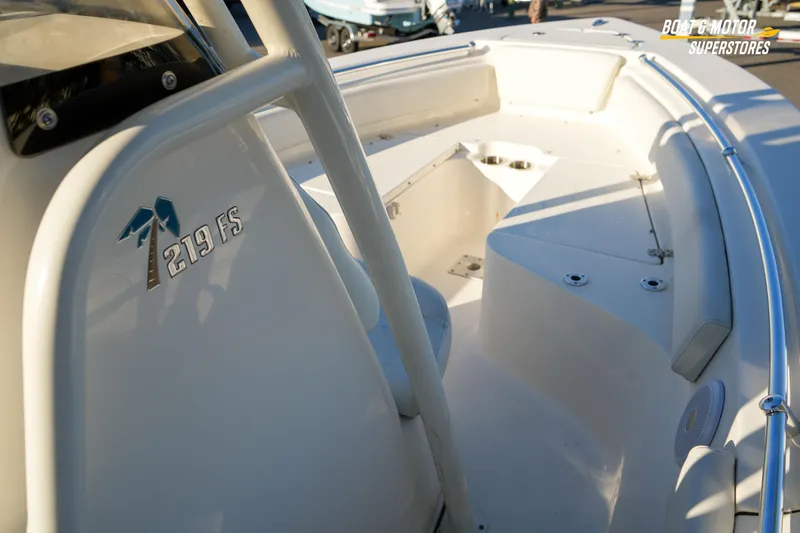 Slide: The Image of 2023 Key West 219 FS boat interior with seating and console details. - 24