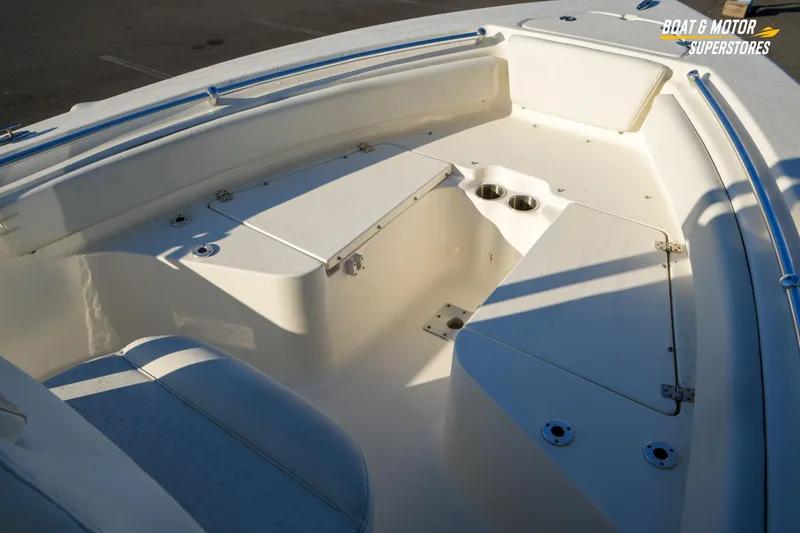 Slide: The Image of 2023 Key West 219 FS boat interior with seating and cup holders. - 25