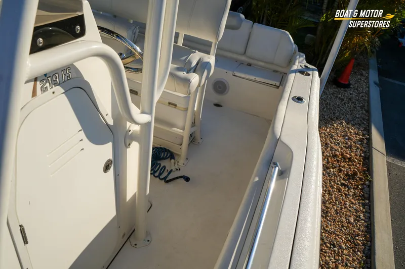 Slide: The Image of 2023 Key West 219 FS boat interior with seating and storage compartments. - 28
