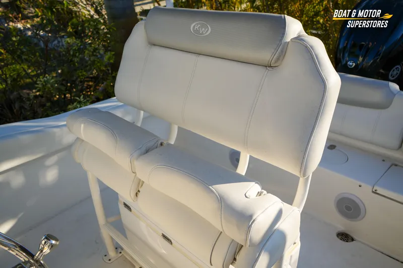 Slide: The Image of 2023 Key West 219 FS boat seating with white upholstery and logo detail. - 31