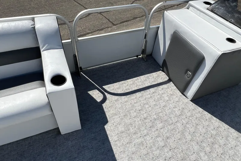Slide: The Image of 1992 Northwoods Fun Deluxe Pontoon interior with seating and cup holders. - 10
