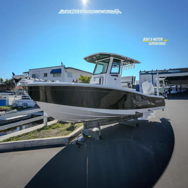 The Image of 2025 Blackfin 262 HB boat on display at a dealership, featuring sleek design. - 0