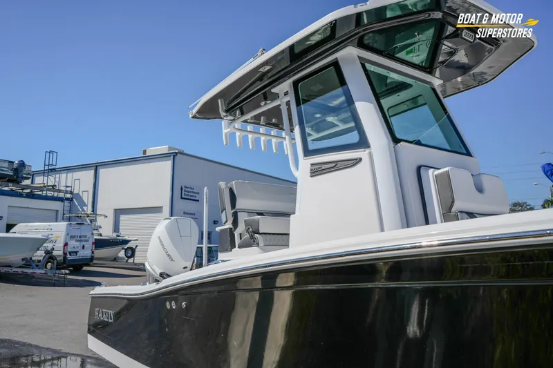 Slide: The Image of 2025 Blackfin 262 HB boat at dealership, showcasing sleek design and modern features. - 12