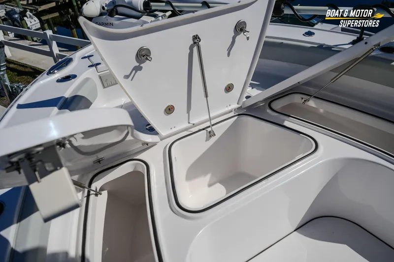 Slide: The Image of 2025 Blackfin 262 HB boat storage compartments open, showcasing spacious design and functionality. - 31