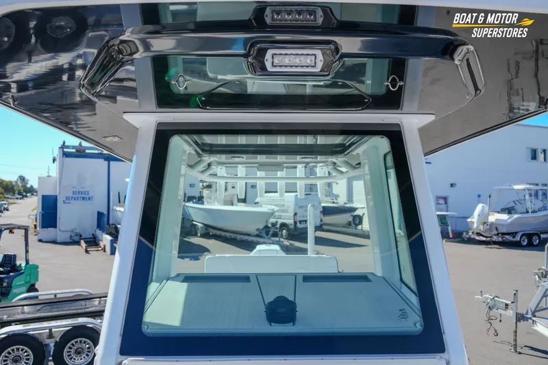 Slide: The Image of 2025 Blackfin 262 HB boat windshield and console at dealership. - 38