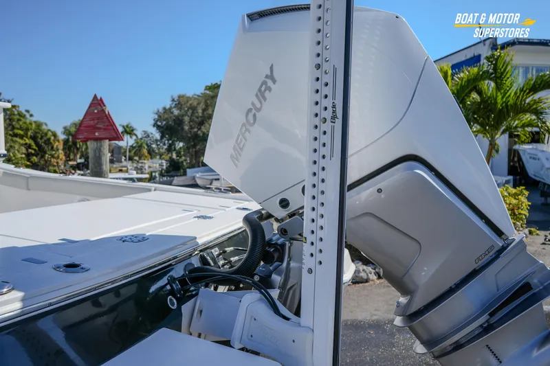 Slide: The Image of 2025 Blackfin 262 HB boat with Mercury engine, docked outdoors. - 4