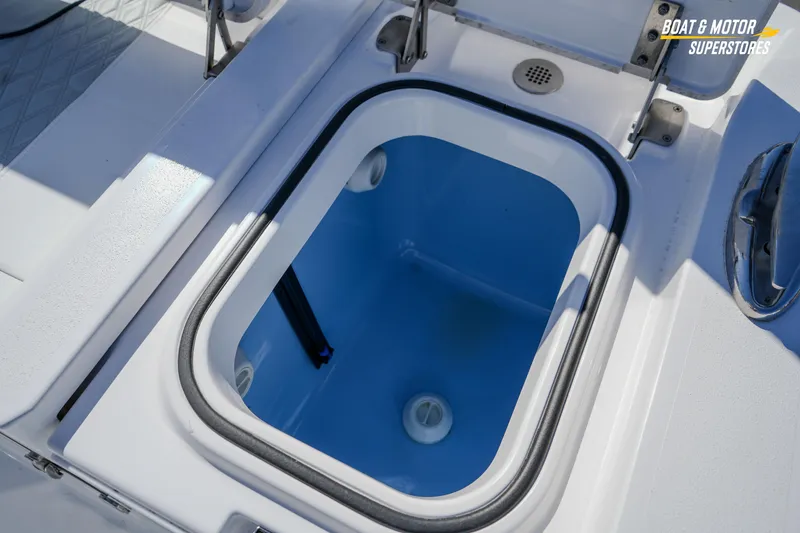 Slide: The Image of Livewell compartment on 2025 Blackfin 262 HB boat, featuring a blue interior. - 43