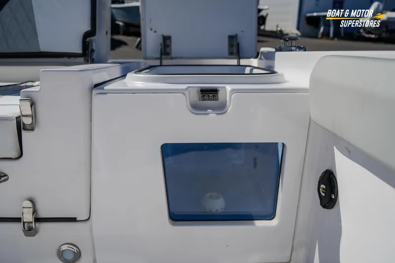 Slide: The Image of 2025 Blackfin 262 HB boat interior detail with storage compartment and latch. - 44