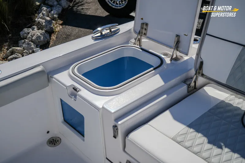 Slide: The Image of 2025 Blackfin 262 HB boat interior with open storage compartment and seating. - 46