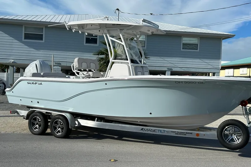 The Image of 2023 Sea Fox 248 Commander boat on trailer, parked in front of a house. - 0