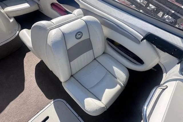 Slide: The Image of 2011 Stingray 185 LS/LX boat interior with white leather seating and carpeted flooring. - 11