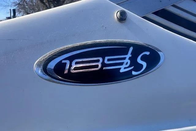 Slide: The Image of 2011 Stingray 185 LS boat emblem on white surface. - 19