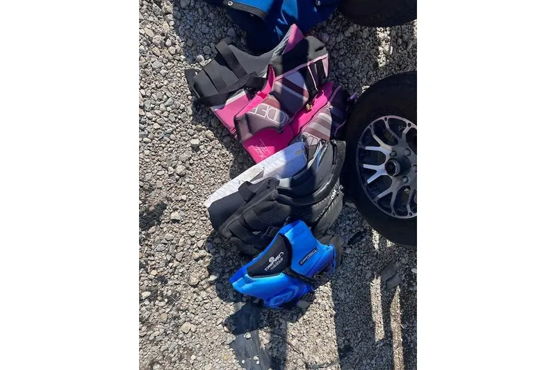 Slide: The Image of Colorful life jackets and a wheel on gravel, Stingray 185 LS/LX, 2011. - 21