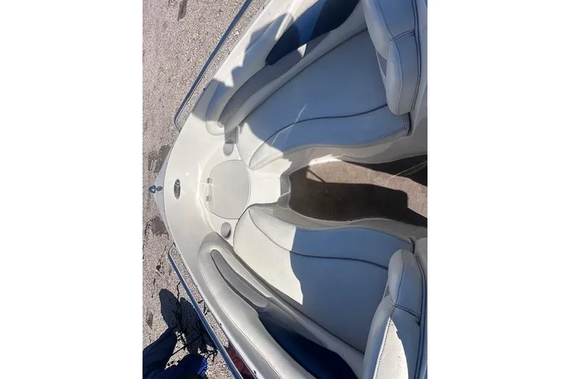 Slide: The Image of 2011 Stingray 185 LS/LX boat interior with white seating and carpeted floor. - 7