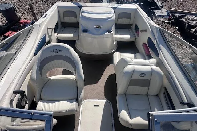 Slide: The Image of 2011 Stingray 185 LS/LX boat interior with white and gray seating arrangement. - 9