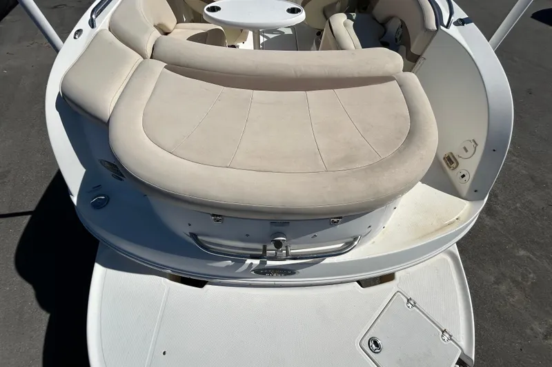 Slide: The Image of 2006 Chaparral Sunesta 236 boat with beige seating and white deck. - 10