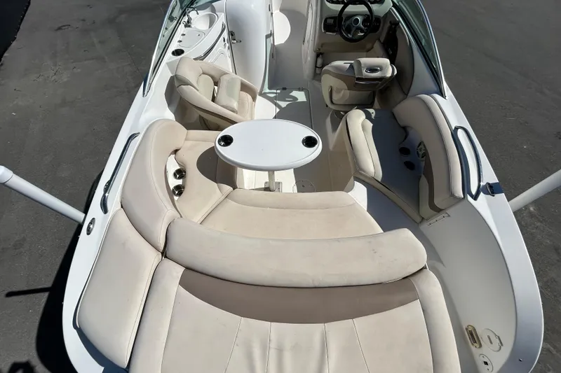 Slide: The Image of 2006 Chaparral Sunesta 236 boat interior with seating and table, viewed from above. - 11