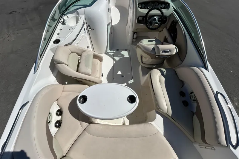 Slide: The Image of 2006 Chaparral Sunesta 236 boat interior with seating and steering wheel. - 12
