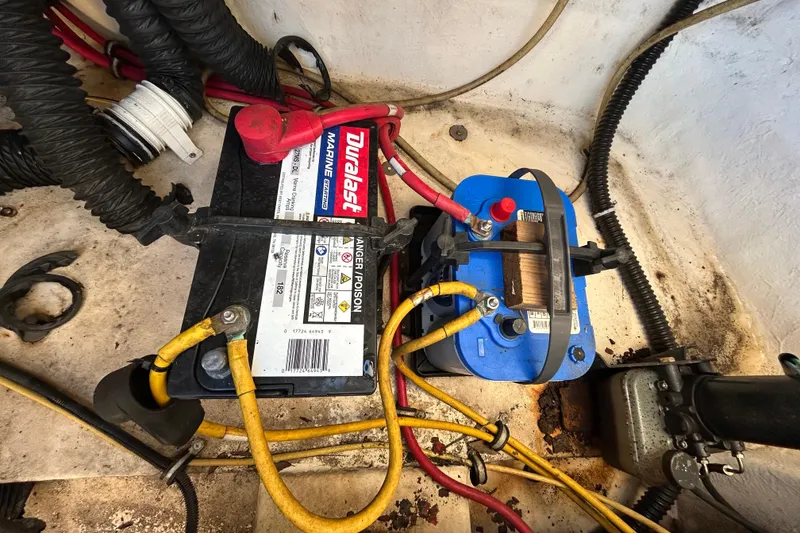 Slide: The Image of 2006 Chaparral Sunesta 236 boat battery compartment with Duralast marine battery. - 25