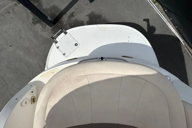Slide: The Image of 2006 Chaparral Sunesta 236 boat interior with seating and swim platform. - 31