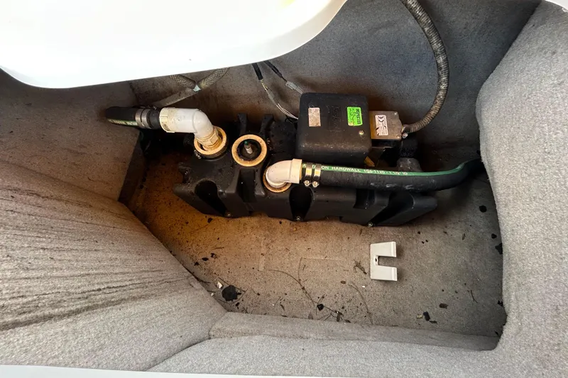 Slide: The Image of 2006 Chaparral Sunesta 236 boat interior plumbing system with pipes and fittings. - 47