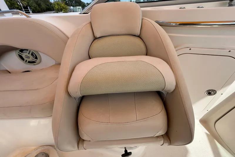 Slide: The Image of 2006 Chaparral Sunesta 236 boat seat with beige upholstery and speaker detail. - 48