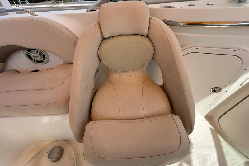 Slide: The Image of 2006 Chaparral Sunesta 236 boat seat with beige upholstery and speaker detail. - 49