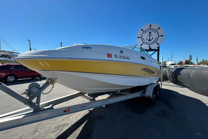 Slide: The Image of 2006 Chaparral Sunesta 236 boat on trailer under clear blue sky. - 7