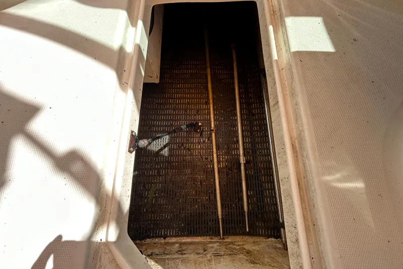 Slide: The Image of 2006 Chaparral Sunesta 236 boat interior with textured flooring and metal rods. - 72