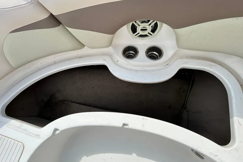 Slide: The Image of 2006 Chaparral Sunesta 236 boat interior with cup holders and speaker. - 75