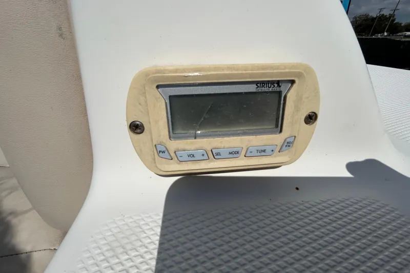 Slide: The Image of 2006 Chaparral Sunesta 236 Sirius satellite radio control panel on boat dashboard. - 79