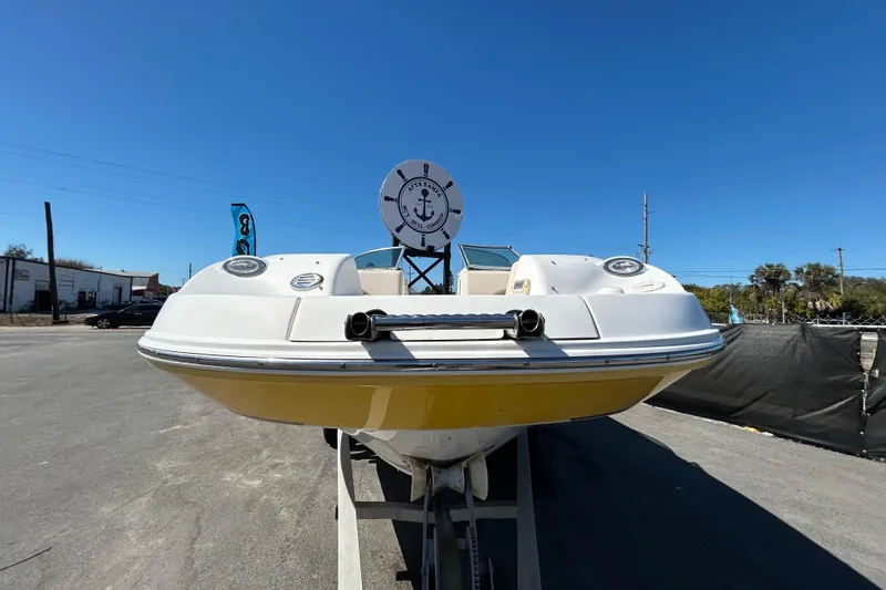 Slide: The Image of 2006 Chaparral Sunesta 236 boat on trailer under clear blue sky. - 8