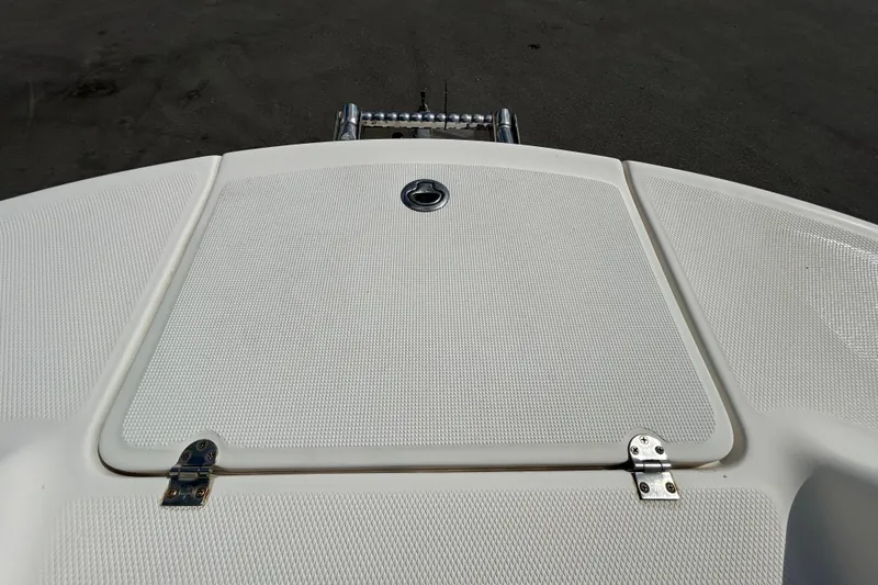 Slide: The Image of 2006 Chaparral Sunesta 236 boat deck with textured surface and hatch. - 80