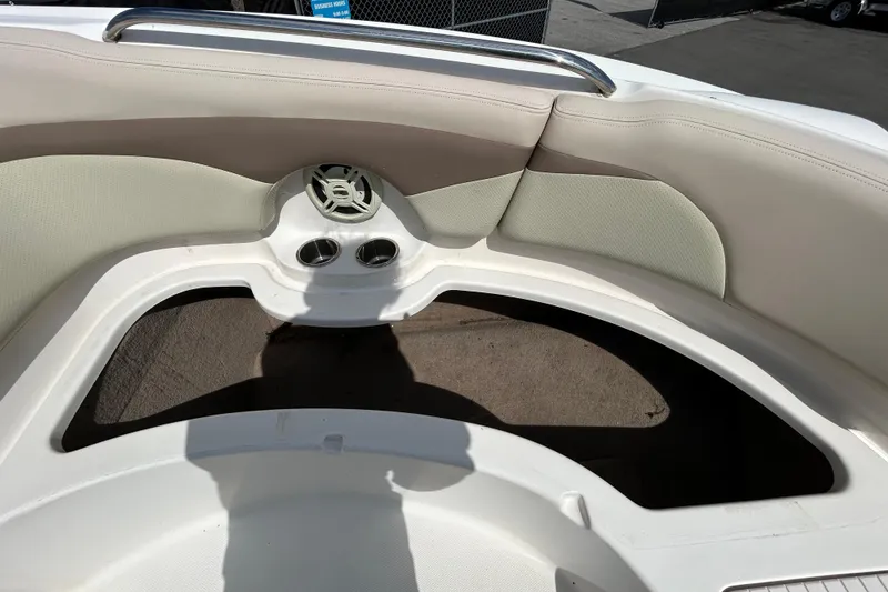 Slide: The Image of 2006 Chaparral Sunesta 236 boat interior with seating and cup holders. - 84