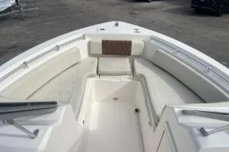 Slide: The Image of 2023 Cobia 220 Dual Console boat interior with spacious seating and sleek design. - 10