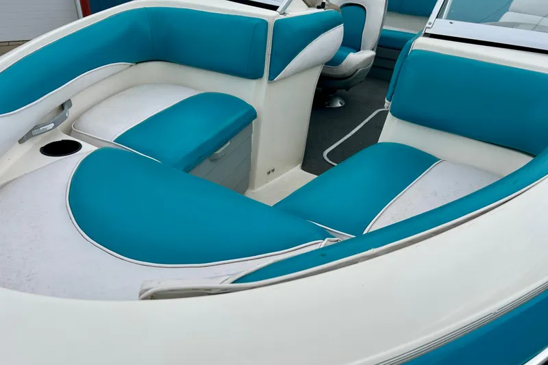 Slide: The Image of 1993 Glastron SSV 175 boat interior with blue and white seating. - 11