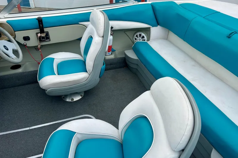Slide: The Image of Interior of a 1993 Glastron SSV 175 boat with blue and white seating. - 12